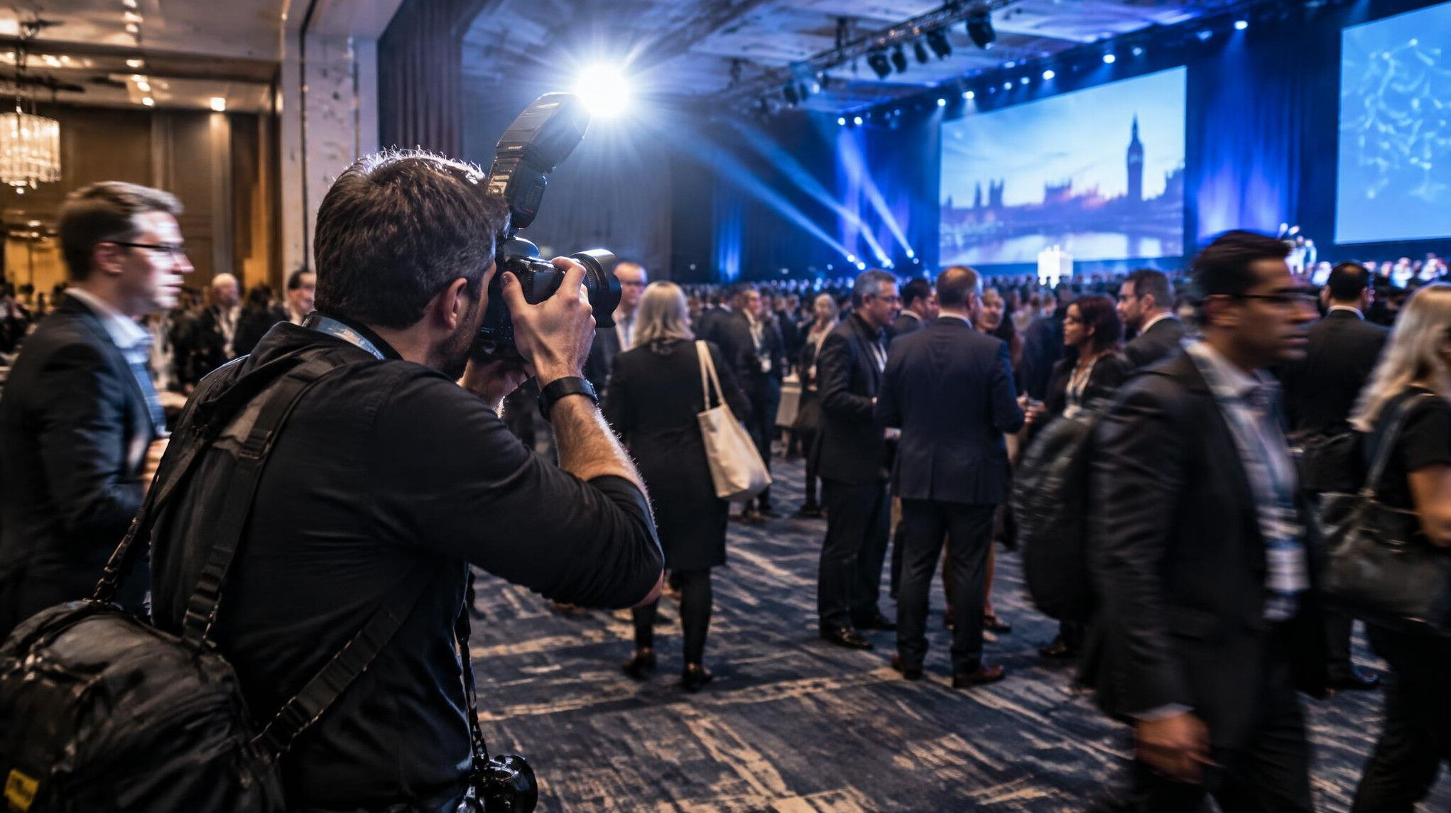 Photographer capturing a live event with a camera flash